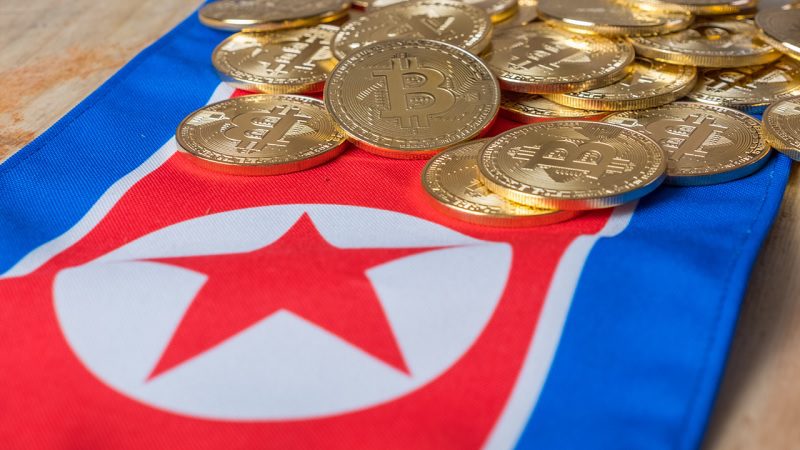 Criptomoeda por cima da bandeira da Coreia do Norte